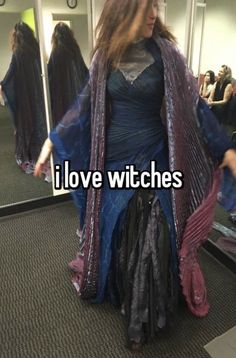 a woman is standing in front of a mirror with the caption i love witches