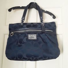 Coach Navy Blue Signature C Style Large Handbag Silver Color Long Excellent Conditionnever Used Bag Has Front Zipper Pocket With Heart Pull Tab Large Roomy Main Bag With Tio Zipper. Excellwnt Condition Amoke Frew Hime. Dr5622 Designer Navy Bag For Everyday Use, Navy Shoulder Bag, Blue Coach Bag For Everyday Use, Elegant Blue Bags With Zipper Closure, Formal Blue Coach Satchel, Elegant Blue Bag With Zipper Closure, Navy Shoulder Bag With Handles, Blue Shoulder Bag With Handle Drop, Designer Blue Bags With Zipper Closure