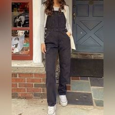 Elevate Your Fashion Game With Our "Black Denim Chic Jumpsuit." This Women's Straight-Leg Overall Exudes Style And Versatility. Crafted From High-Quality Denim, It Offers Both Comfort And Durability. The Chic Design Effortlessly Combines A Classic Black Hue With Modern Aesthetics. Whether You're Out For A Casual Day Or A Night On The Town, This Jumpsuit Is Your Go-To Choice For A Sleek And Fashionable Look. Embrace Confidence And Sophistication With This Wardrobe Essential. Trendy Black Overalls For Workwear, Black Cotton Overalls For Fall, Trendy Black Workwear Overalls, Casual Black Straight Leg Overalls, Casual Shortalls For Workwear In Fall, Casual Fall Workwear Shortalls, Fall Workwear Shortalls, Trendy Black Denim Jumpsuits And Rompers, Black Cotton Overalls Jeans