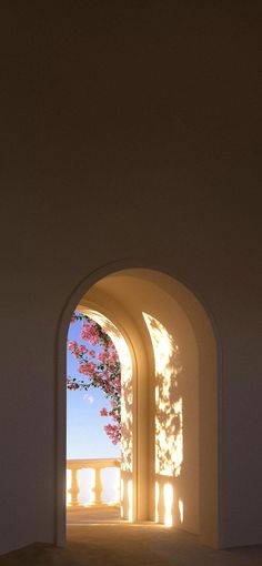 an arched doorway with the light coming in through it and flowers growing on the wall