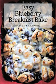 a blueberry breakfast bake in a red pan with white icing on top