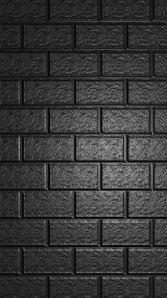 a black brick wall that is very dark