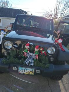 a truck with christmas decorations on the hood