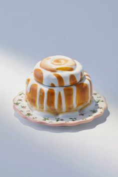 a cake sitting on top of a plate covered in icing