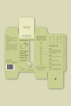 the back and side of a green book with white paper on it, sitting in front of a gray background