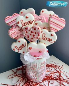 valentine's day cookies in a cup on a table