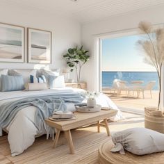 a bedroom with a large window overlooking the beach and ocean is shown in this rendering