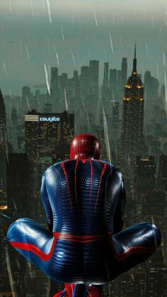 the amazing spider - man is standing in front of a cityscape