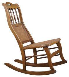 a wooden rocking chair with wicker seat and backrests on an isolated white background