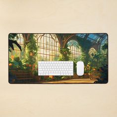 a computer mouse pad with an image of a tropical greenhouse on it's side