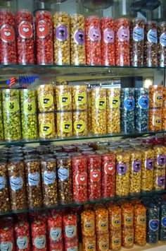 the shelves are filled with many different kinds of candy