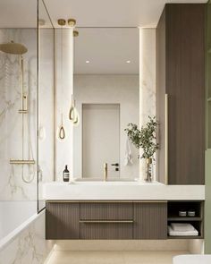 a bathroom with marble counter tops and white walls, along with an open shower area