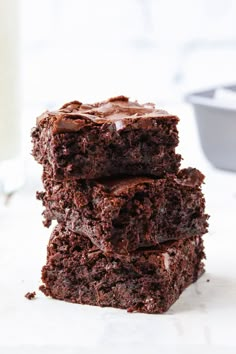 three chocolate brownies stacked on top of each other