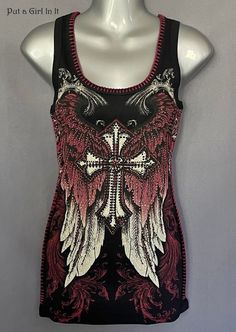 New Womens Plus Size Vocal Apparel embellished black burgundy cross angel wings whipstitch tank top This incredibly unique Vocal shirt is just stunning Gorgeous black with burgundy whipstitch embellished top Stunning embellished crystal cross with angel wings design on front and back Beautiful Whipstitch contrast on neckline and sides SO MUCH BLING! Just GORGEOUS Also Comes in Burgundy in other listing Made in USA by Vocal Apparel I have been selling Vocal clothing for over 16 YEARS now and just LOVE this brand! Please see measurements 100% Ribbed Cotton - Has stretch Measured without stretching - *1X - 18" across chest  - approx. 28" shoulder to hem *2X - 19.5" across chest - approx. 29" shoulder to hem *3X - 21" across chest - approx. 29" shoulder to hem BE VOCAL - STAND OUT IN A CROWD & Sinful Clothing, Biker Outfit, Biker Chick, Boot Cut Denim, Shopping Cart, Rocker, Tank Top Fashion, Chic Style, Cool Outfits