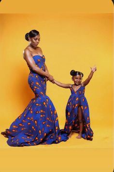 two women in matching dresses holding hands