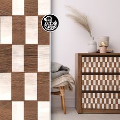 a wooden dresser sitting next to a white and brown checkered wall