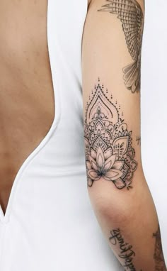 a woman with a tattoo on her arm