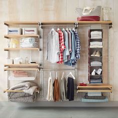 an organized closet with clothes and other items