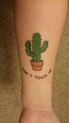 a small cactus tattoo on the left inner forearm and wrist with words don't touch me