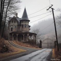 an old house sitting on the side of a road