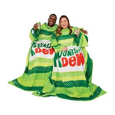 Stay cozy while you chill with the Snuggie Mountain Dew! This original blanket with sleeves keeps your hands free so you can game, read, study, or just relax on the couch. When you inevitably make a mess, just throw it in the wash and keep snuggling.THE ORIGINAL SNUGGIE Blanket now featuring Pepsi products are proud to have kept America snug for over 10 years in our cozy fleece blanket with sleeves. SNUGGIE Blanket is a functional wearable blanket, built for relaxation. It will keep you warm whe Pepsi Products, Snuggie Blanket, Can Game, Blanket With Sleeves, Fall Sports, Green Retro, Mountain Dew, Wearable Blanket, Just Relax