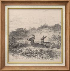 two deer running through the woods in black and white ink on paper, framed in wood frame