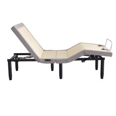 an adjustable reclining bed with wheels on it