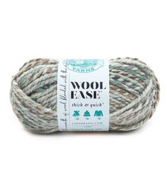 wool - ease thick or quick yarn in grey, white and blue colors on a white background