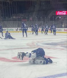 hockey players on the ice during a game