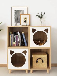 a book shelf with books and pictures on the top, along with a wicker basket