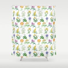 a shower curtain with colorful flowers on it