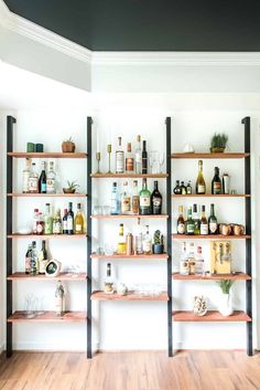 a room with shelves filled with bottles and liquor