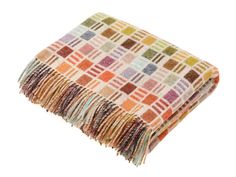 a multicolored blanket with fringes on the bottom and one in brown, yellow, green, orange, red