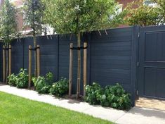 an image of a fence with trees in it