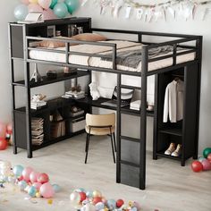 a loft bed with a desk underneath it and lots of balloons around the room on the floor