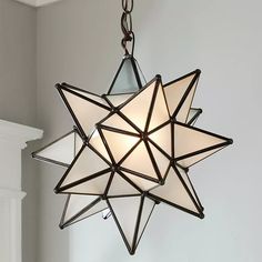 a star light hanging from the ceiling in a room