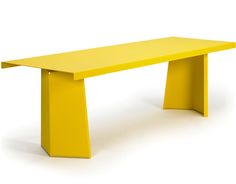 a yellow bench sitting on top of a white floor