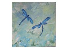 two blue dragonflies are flying in the sky on a green and blue painting background