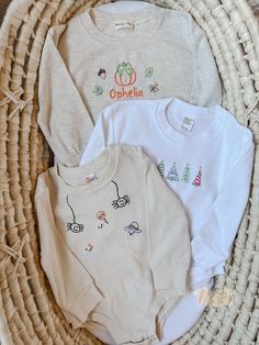 Hand embroidered sweatshirt rompers: Sizes 0-6m, 6-12m, 12-18m 3 colors: Heather oatmeal - buttery soft 65% polyester, 35% cotton blend White & beige - thicker, 100% cotton *Pictured are some examples, but your romper can be embroidered any way you want! Either give a detailed note in your order or message us!* TAT is 1-2 weeks Handmade with love Baby Clothes Embroidery Ideas, Hand Embroidered Baby Clothes, Hand Embroidery Kids Clothes, Hand Embroidery Baby Clothes, Baby Clothes Embroidery, Embroidered Baby Onesie, Embroidery Kids Clothes, Baby Onesie Embroidery, Embroidered Baby Gifts