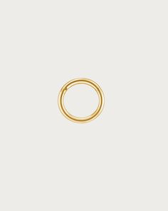 a gold ring on a white background