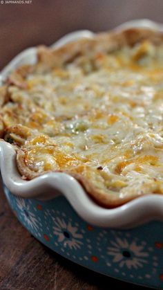 a casserole dish sitting on top of a wooden table