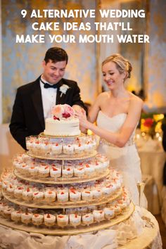 the bride and groom are cutting their wedding cake at the reception table with cupcakes in front of them