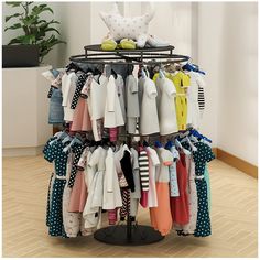 there is a clothing rack with many shirts on it