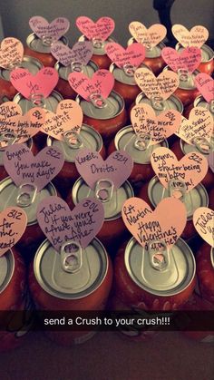 there are many hearts on the top of cans with notes attached to each canister