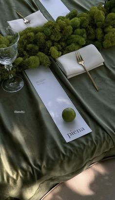 the table is set up with place settings for an event or special occasion to be attended