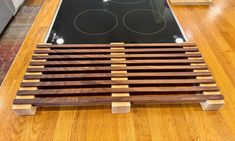 a stove top sitting on top of a wooden floor