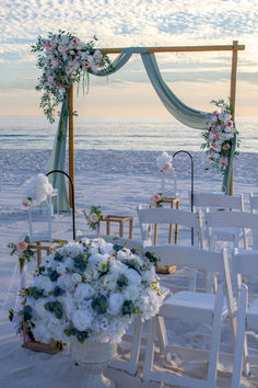 an outdoor wedding setup on the beach