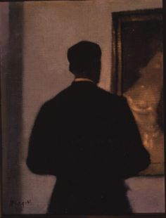 a man standing in front of a painting with his back turned to the camera, wearing a suit and tie