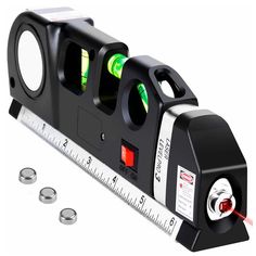 a black and white measuring machine with green lights on it