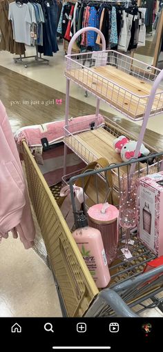 a shopping cart filled with pink items in a store